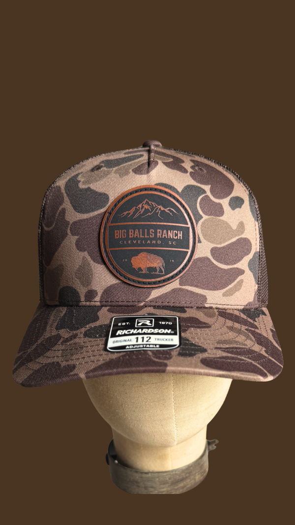 Camouflage trucker hat with BBR logo on a leather patch 